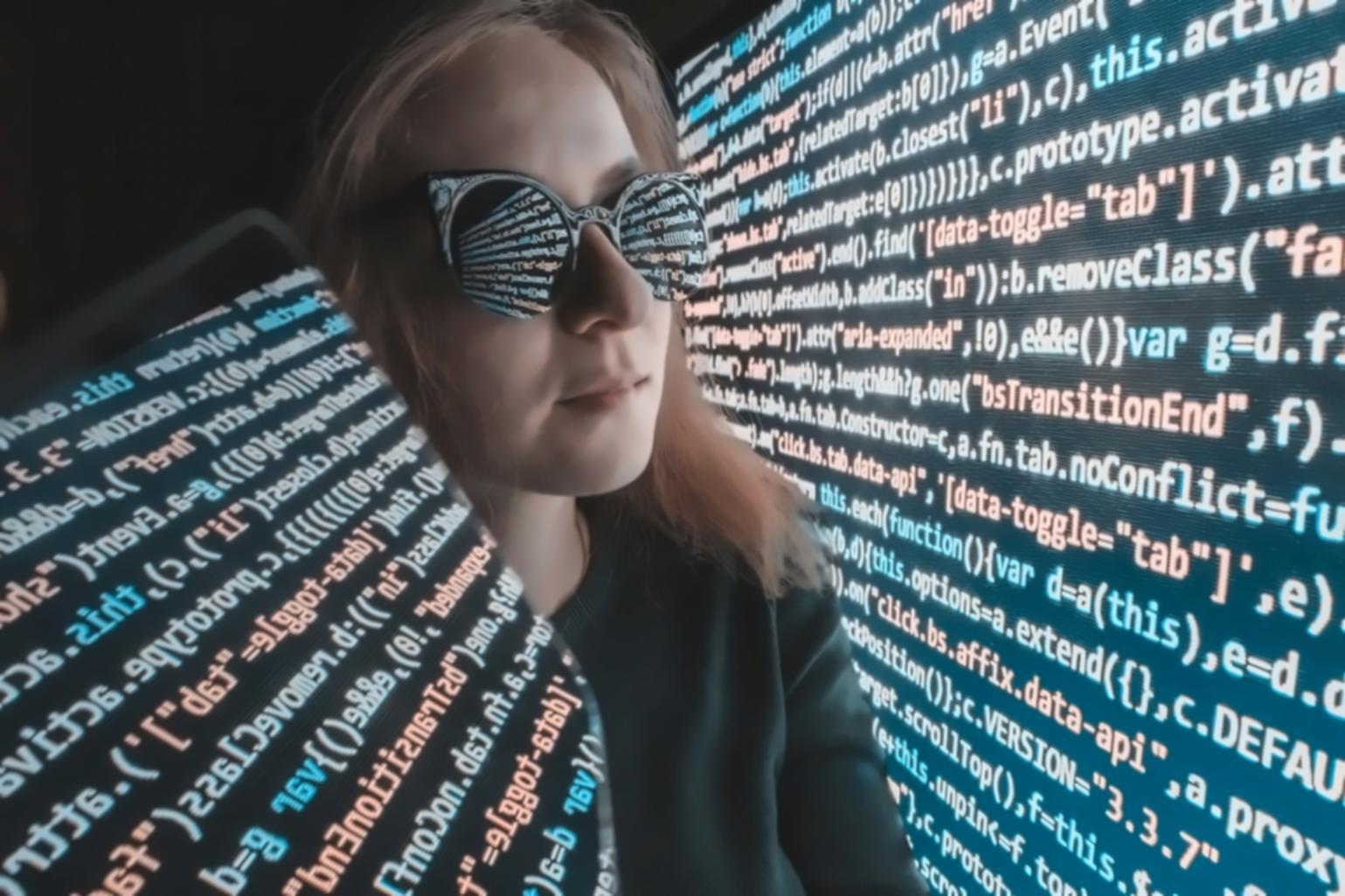 Security audit process with code review and testing frameworks displayed on screens